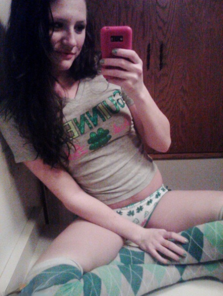 Amateur girl Freckles 18 takes selfies while going topless in cute panties