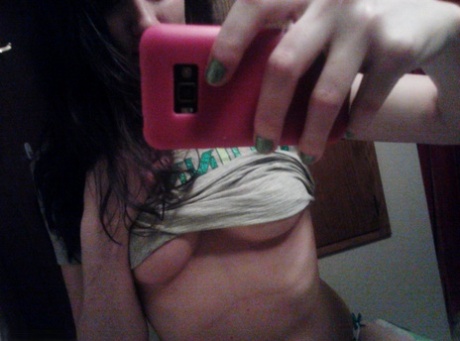 Amateur girl Freckles 18 takes selfies while going topless in cute panties