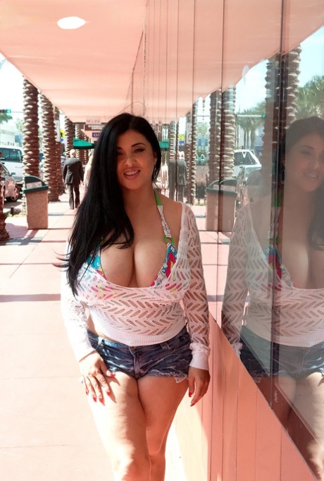 Latina female Daylene Rio releases her massive tits from bikini top