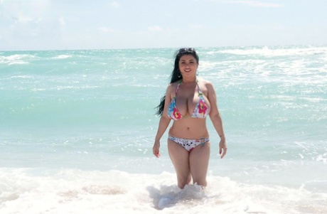 Latina female Daylene Rio releases her massive tits from bikini top