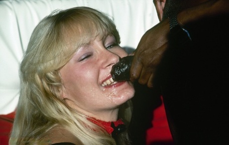 Busty vintage broad gets a load of joy juice from a hard black cock