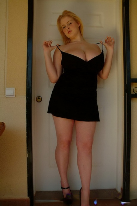 Big tits fatty Ashley Sage Ellison drops her dress to expose massive melons