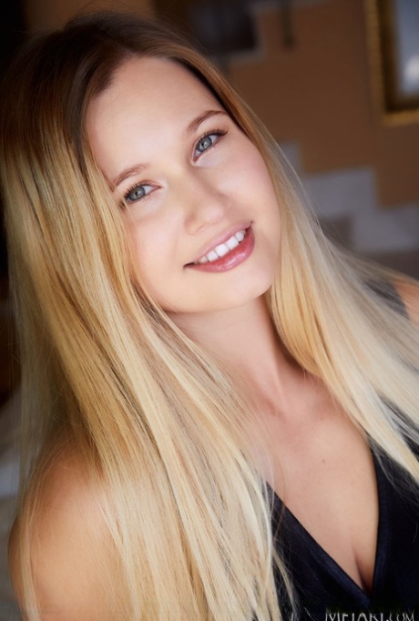Gorgeous blonde teen Stella Cardo ditches a black dress while getting naked