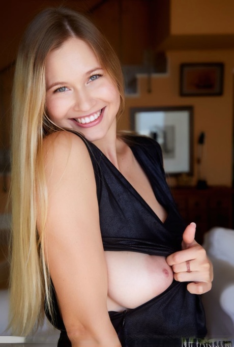 Gorgeous blonde teen Stella Cardo ditches a black dress while getting naked