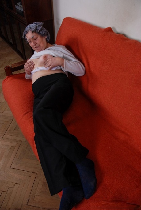 Grey haired granny Margarethe reveals her amazing breasts and plays with a toy