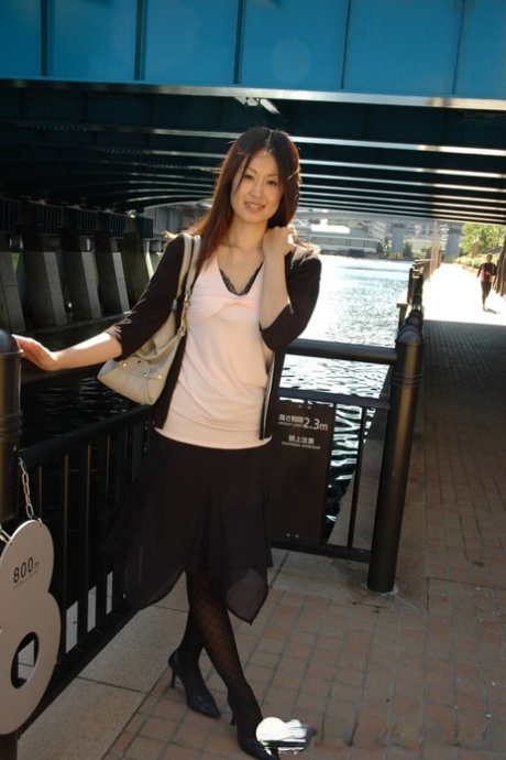 Petite Asian cutie exposes her fabulous body and poses naked in a solo