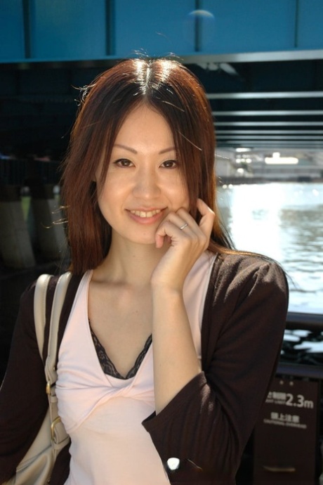 Petite Asian cutie exposes her fabulous body and poses naked in a solo