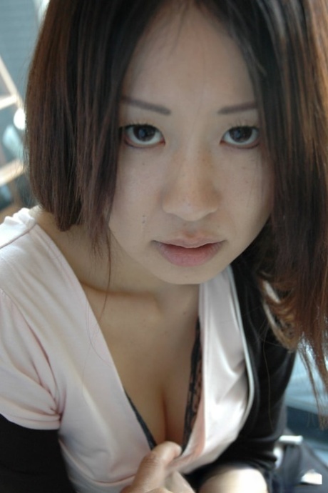 Petite Asian cutie exposes her fabulous body and poses naked in a solo