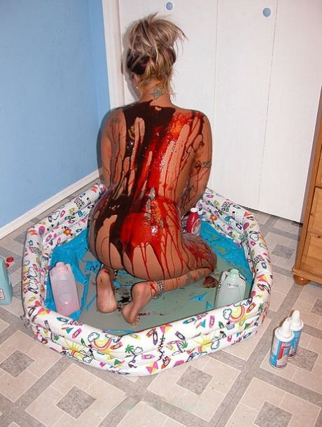 Blonde Lexxi Meyers pours milk, sauces and whipped cream all over her body